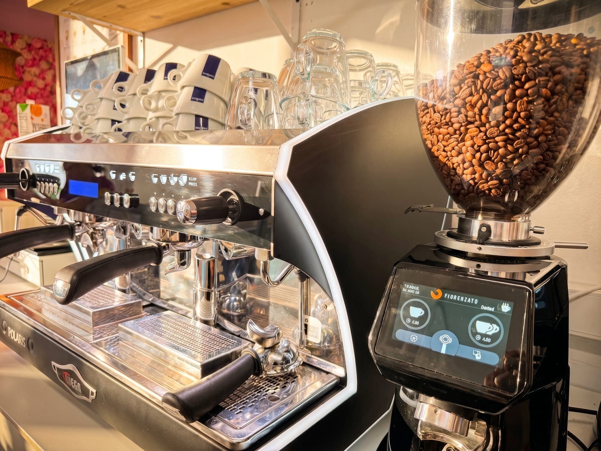 The espresso machine and grinder behind the bar