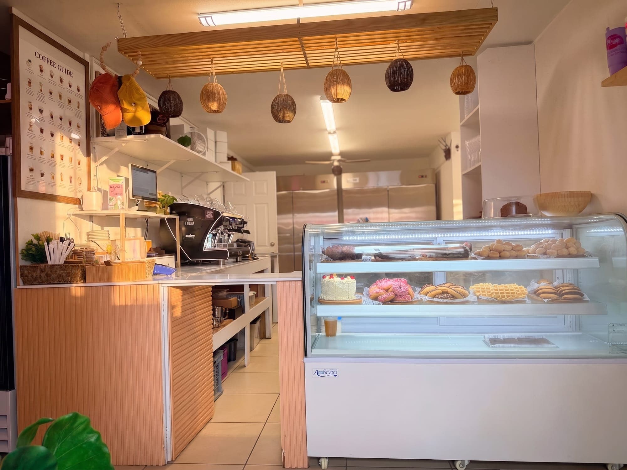 The counter and pastry case seen from the seating corner