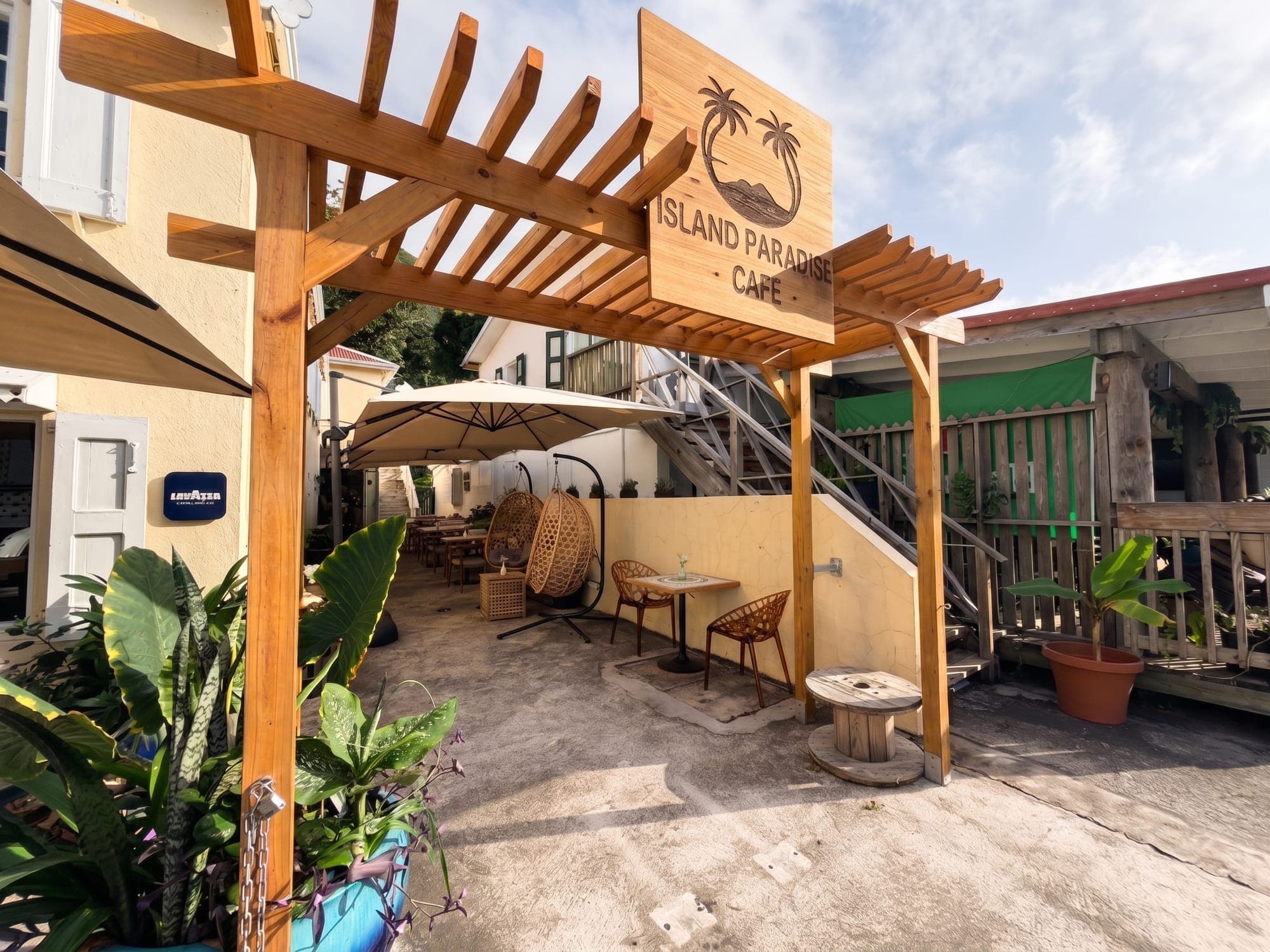 The courtyard terrace with parasols and plants in the morning