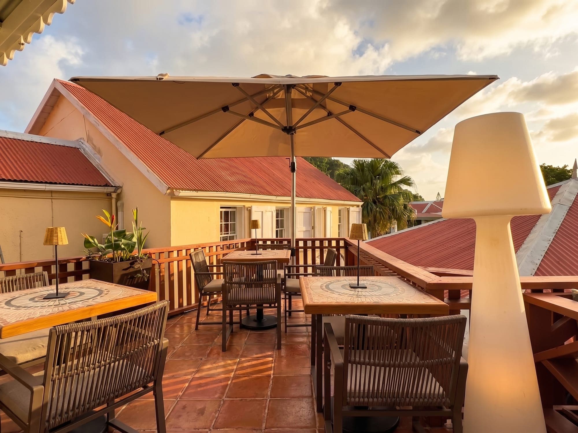 The terrace parasols against the red roofs of Windwardside