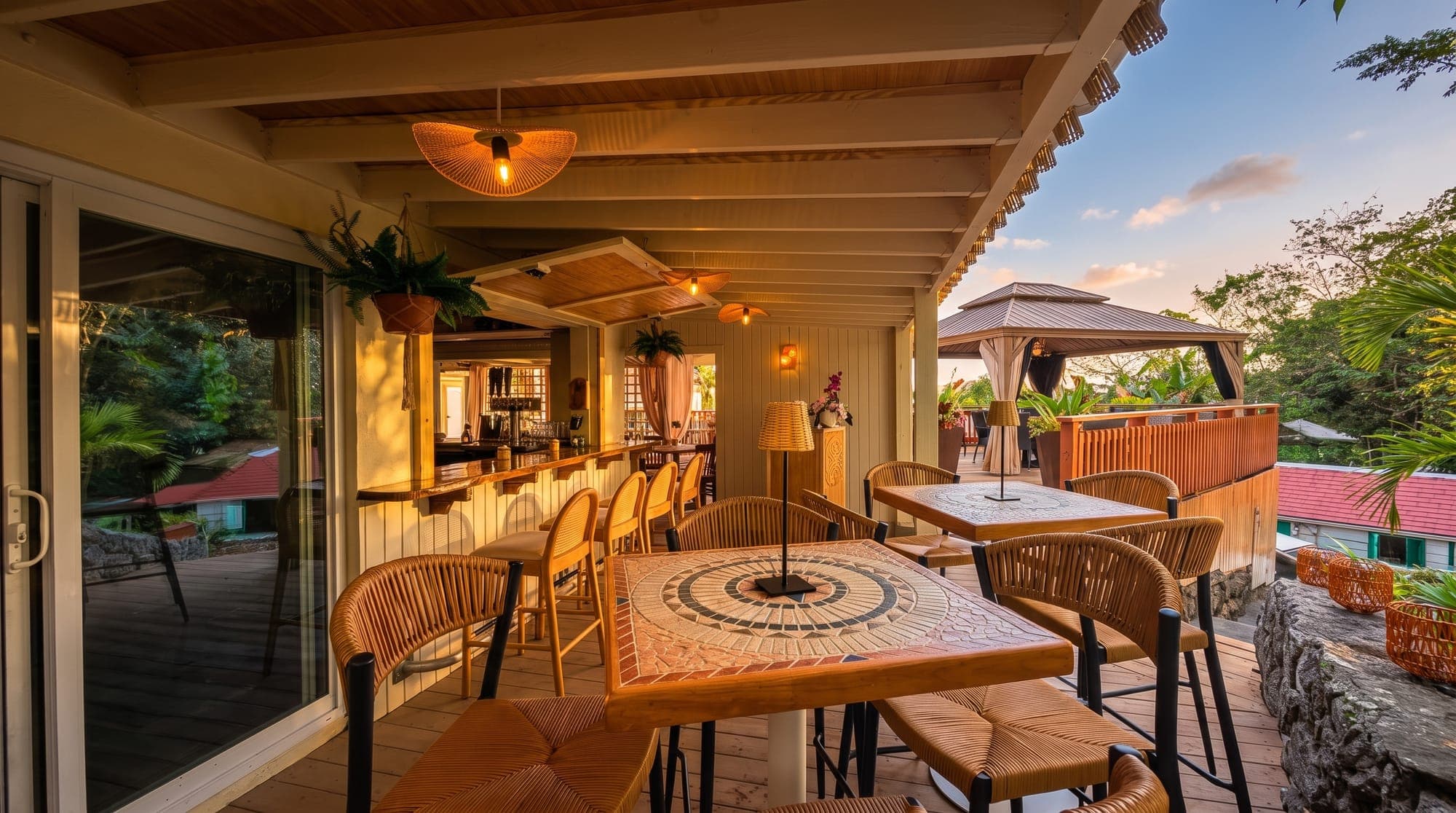 The dining room at golden hour, doors open to the terrace