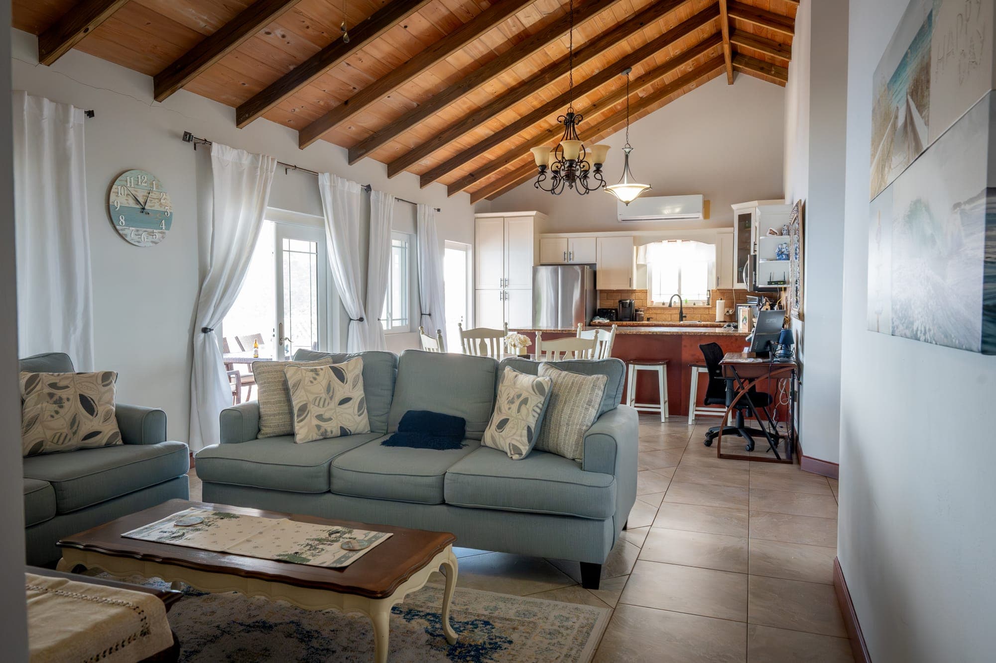 Living room of Tropical Paradise with a high wooden ceiling